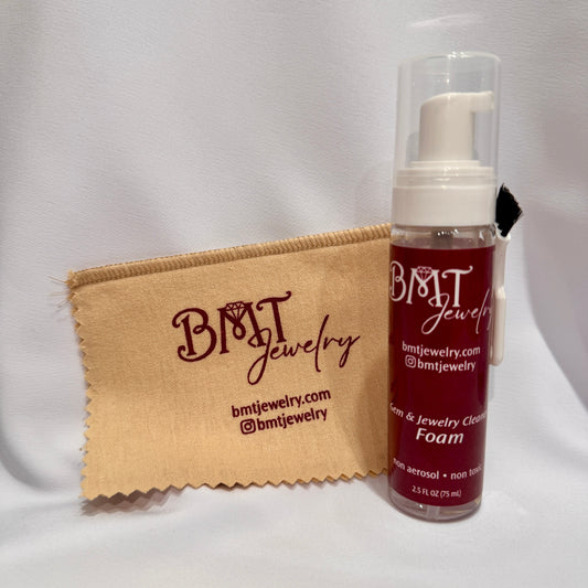 Tan BMT Jewelry Cleaning Cloth with red logo and BMT Jewelry cleaning foam with red label and white logo
