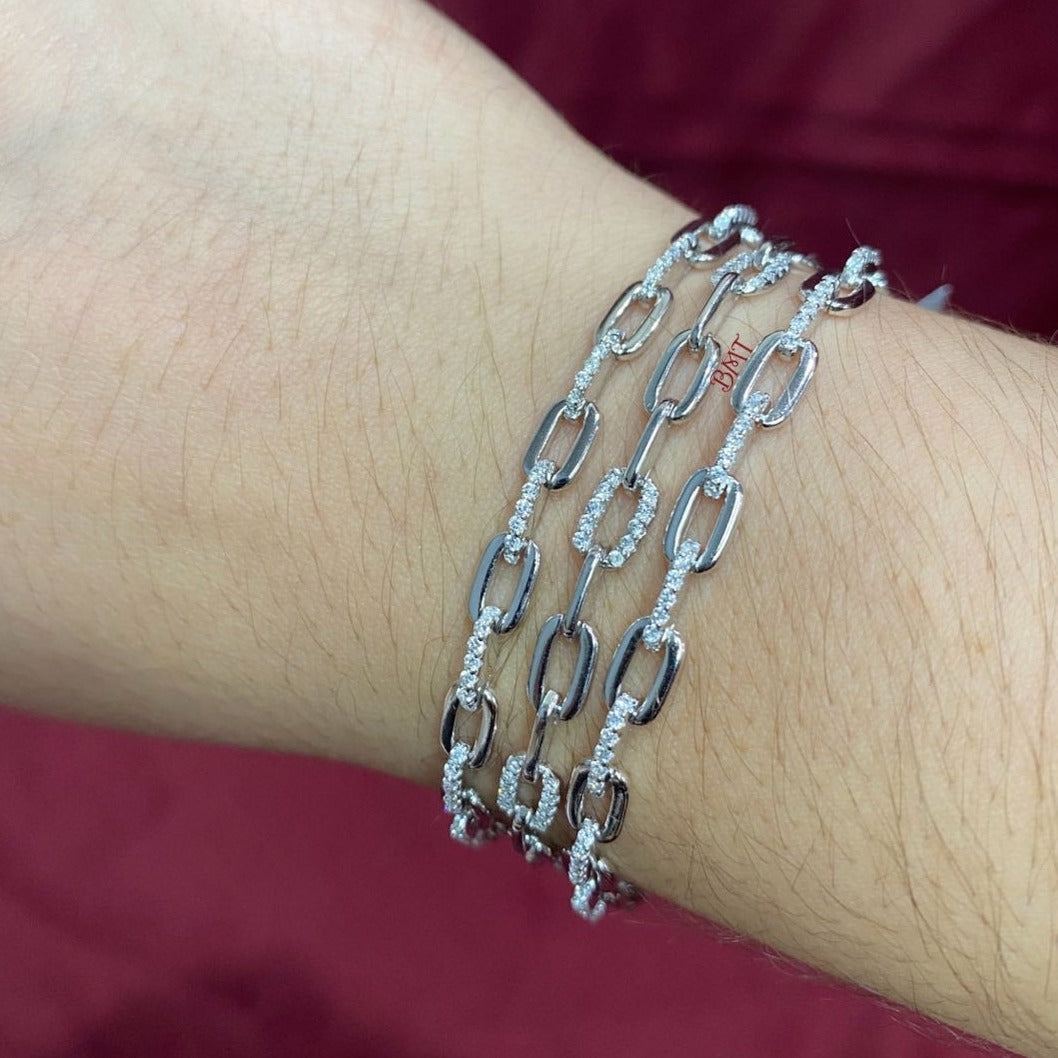Three Paperclip chain bracelets with Zirconia on model