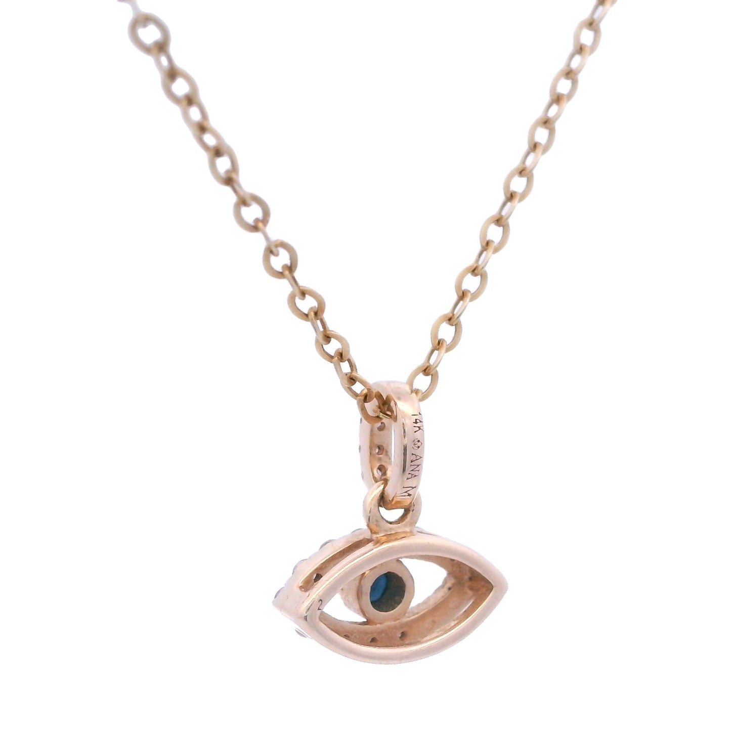 Back view of a yellow gold eye pendant outlined with white diamonds and has a blue sapphire in the center. The yellow gold pendant is held by a thin yellow gold chain.