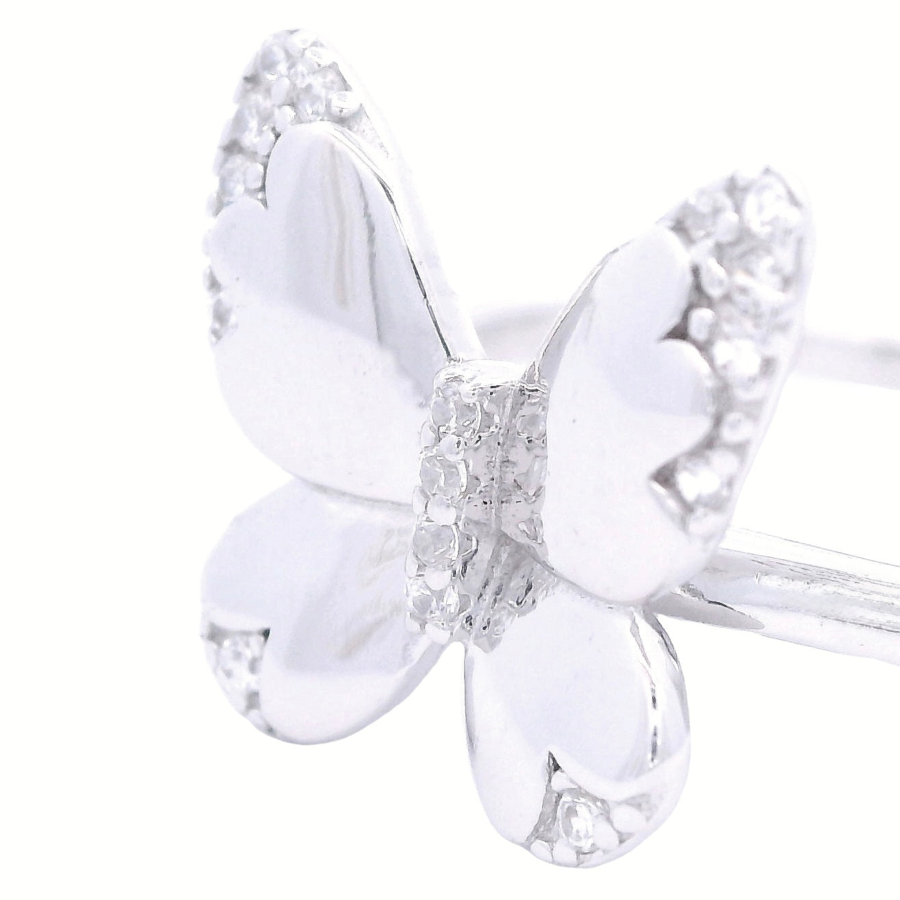 Close up of silver ring with a solid thin band and a butterfly in the center. The butterfly has clear round zirconia accents in the edges of each butterfly wing and in the center.