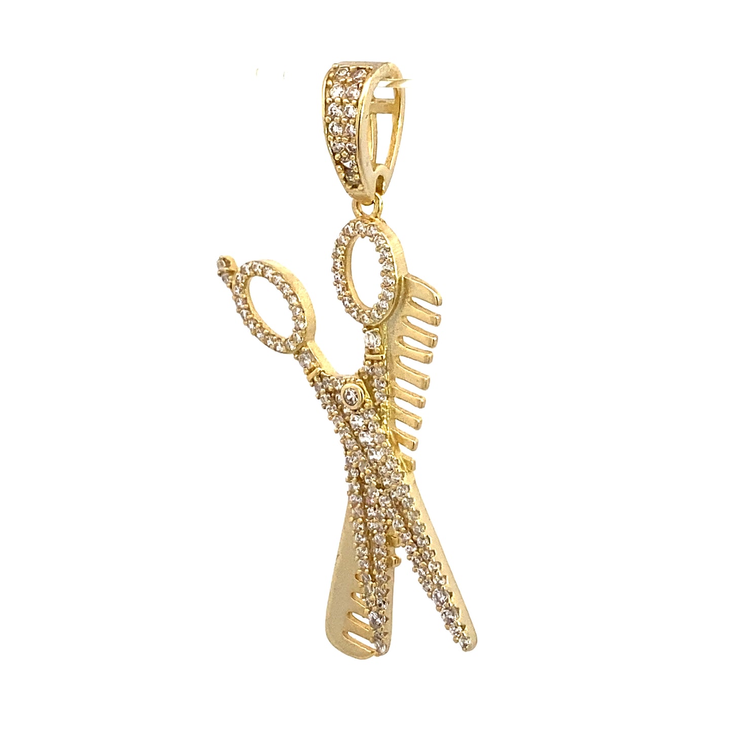Angle view of sterling silver gold pendant of a scissor and a comb. The scissor has white zirconia.