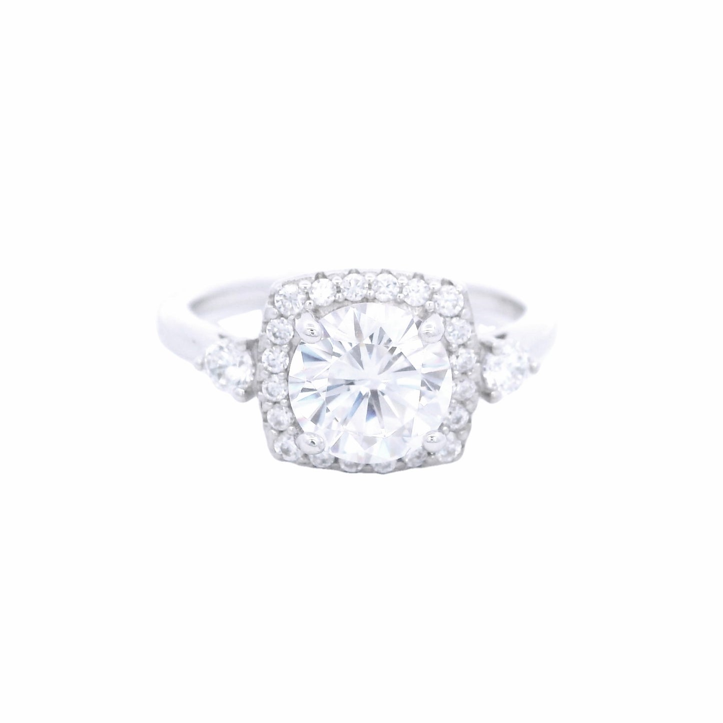 Front view of Sterling silver ring with round white zirconia and a rectangular halo with round white zirconia around it. There is a round white zirconia on each side of the band.