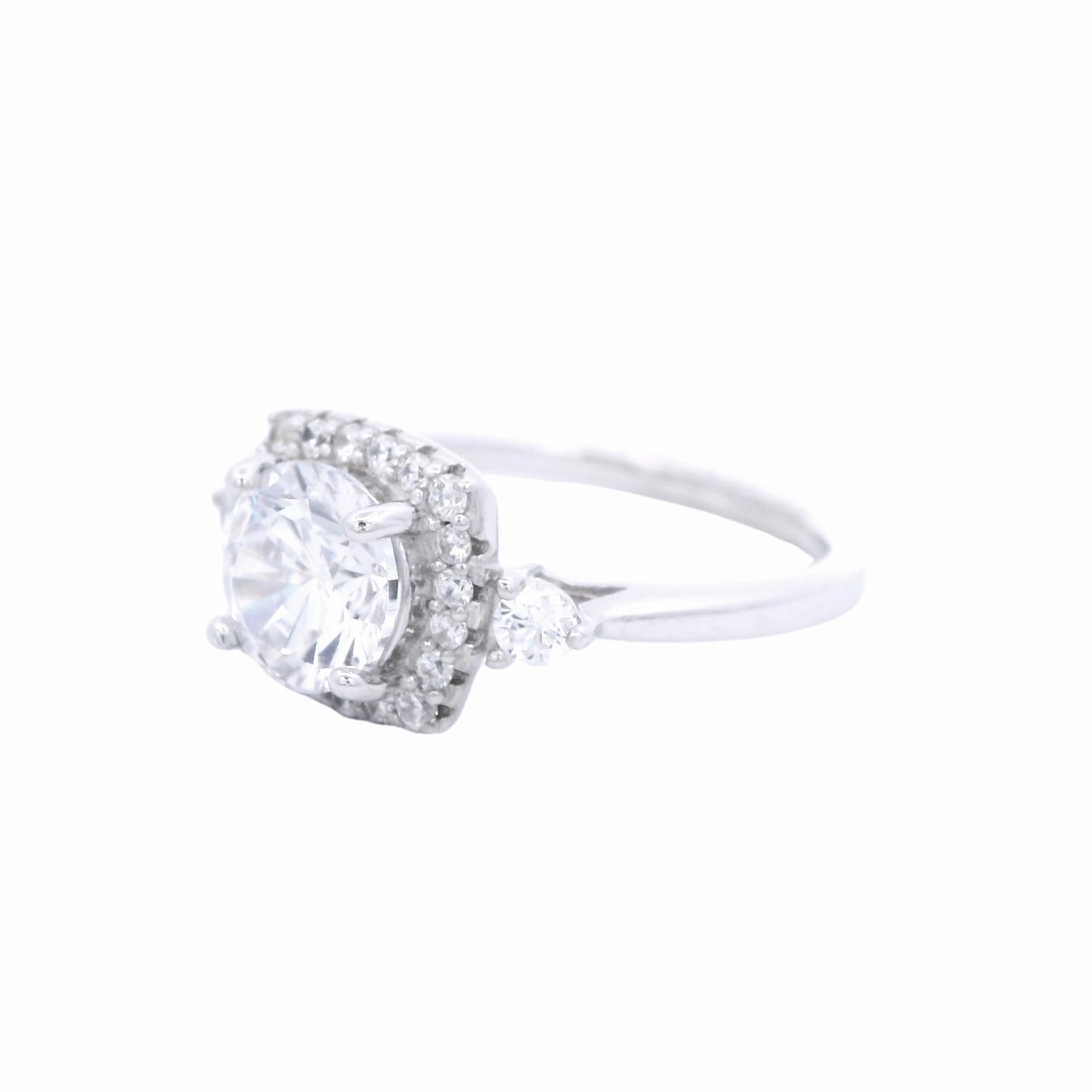Side view of Sterling silver ring with round white zirconia and a rectangular halo with round white zirconia around it. There is a round white zirconia on each side of the band.
