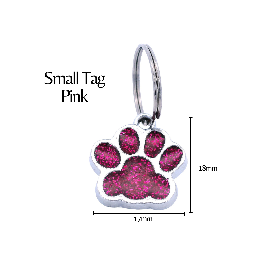 Pink glitter paw print tag with dimensions on a white background. There is black text that says "Small Tag Pink" and the height is labeled as 18mm and the width as 17mm.