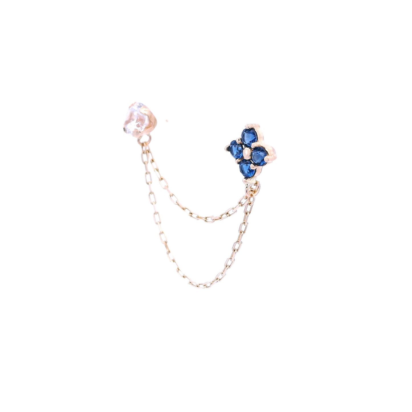 Angled view of a white round Zirconia stud with a flower stud that has 4 blue round zirconia. The studs are connected by two thin gold chains.