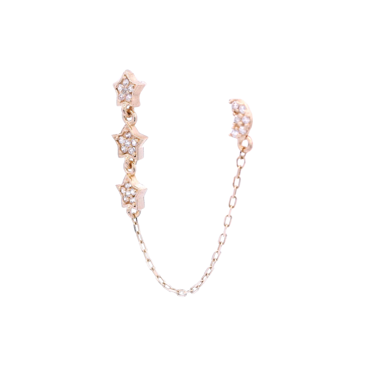 Angled view of a yellow gold stud with 3 small stars that are vertically aligned, and a yellow gold stud of a crescent moon. Both studs have white zirconia and they are connected by a thin gold chain.