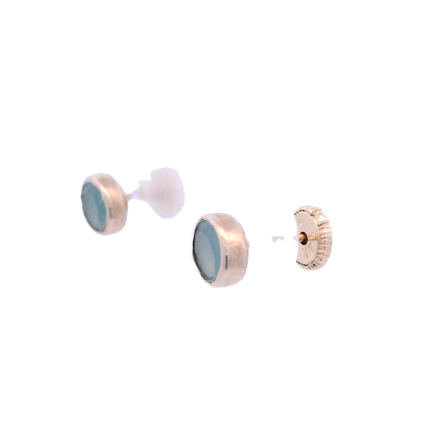 Angled view of 5mm flat round stud with a gold base a green/gray zirconia.