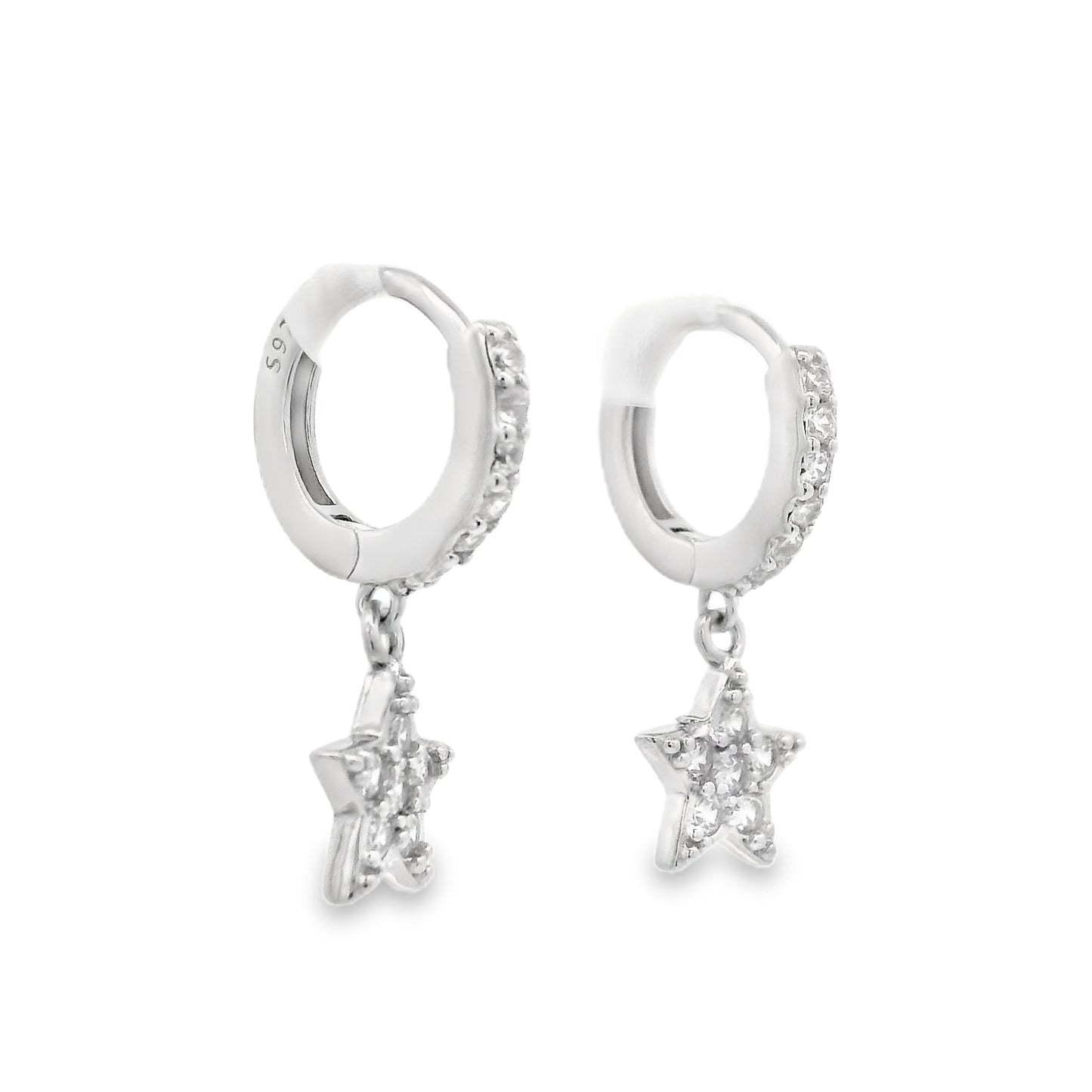 Angled side view of silver huggie hoops with a star that dangles below each hoops. The hoop and star are both filled with clear round zirconia.