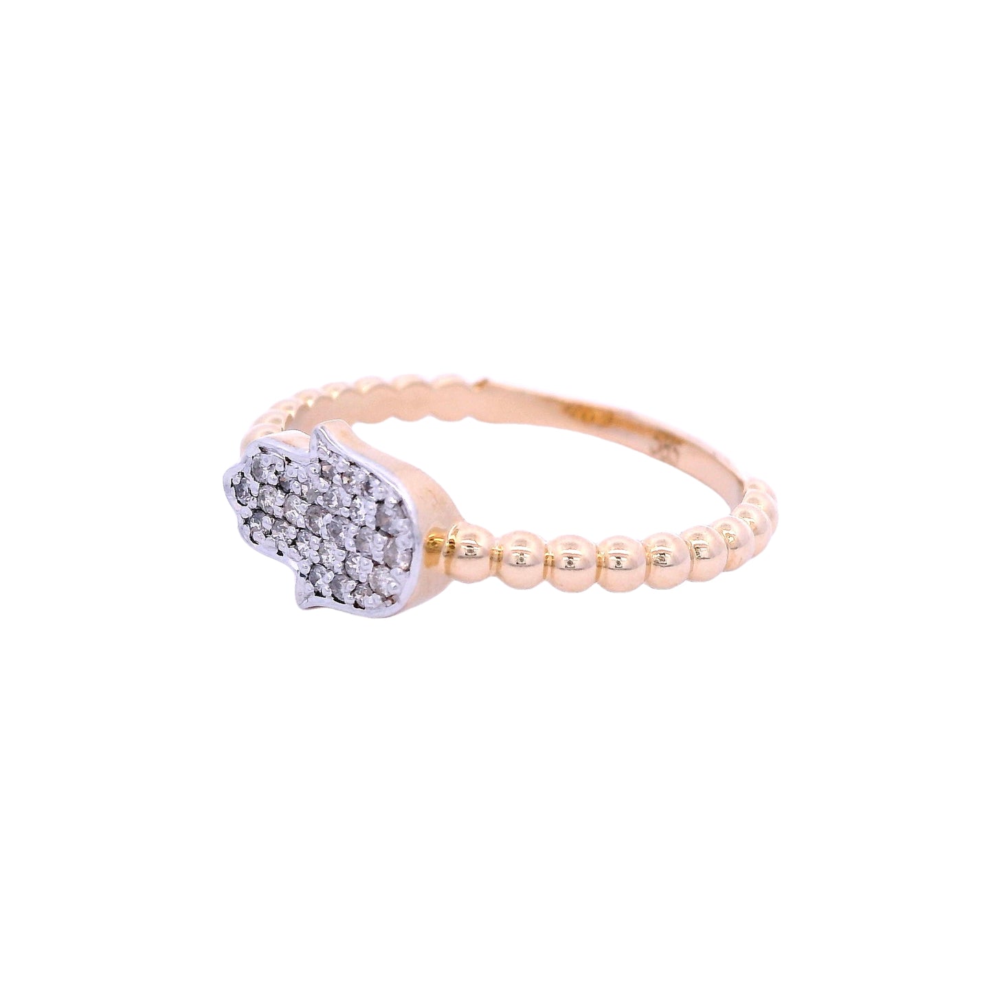 Angled view of yellow gold ring. The band of the ring has a circular design. In the center of the ring there is a horizontal white old hamsa hand. The hand is filled with small round white diamonds.