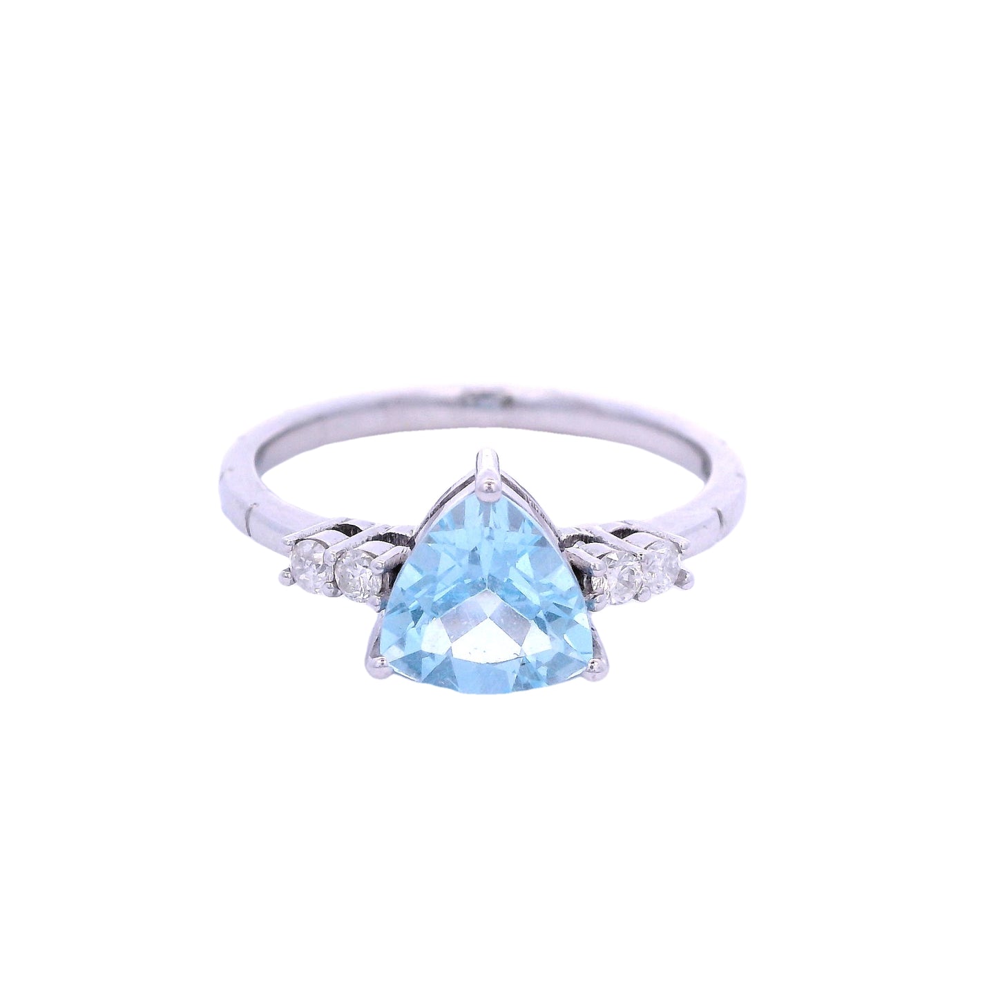 Front view of white gold ring. The ring has a triangular light blue aquamarine stone in the center. On each side of the stone there are2 small round white diamonds.