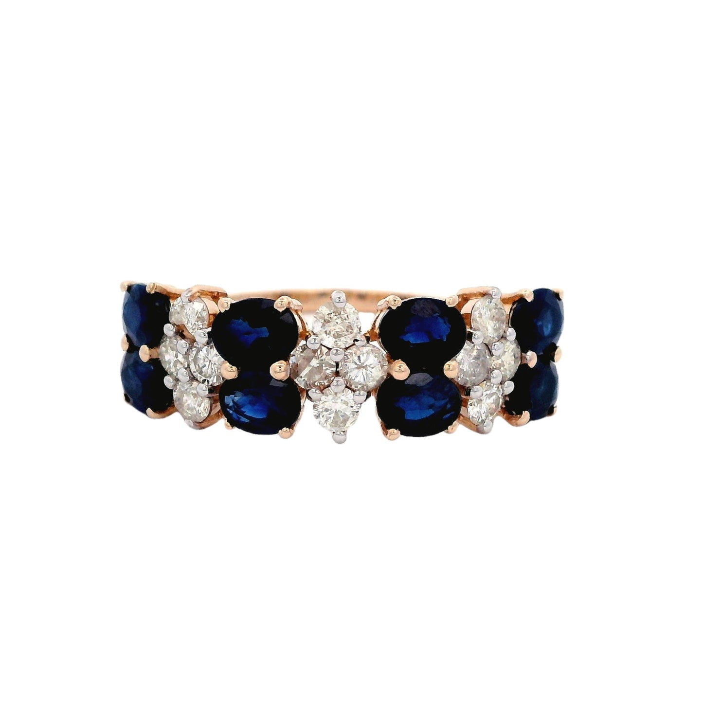 Front view of yellow gold ring. The ring has a pattern between blue sapphire and white diamond. The blue sapphire section has two oval blue sapphires laying horizontally. The diamond section has four round diamonds in the shape of a rhombus.
