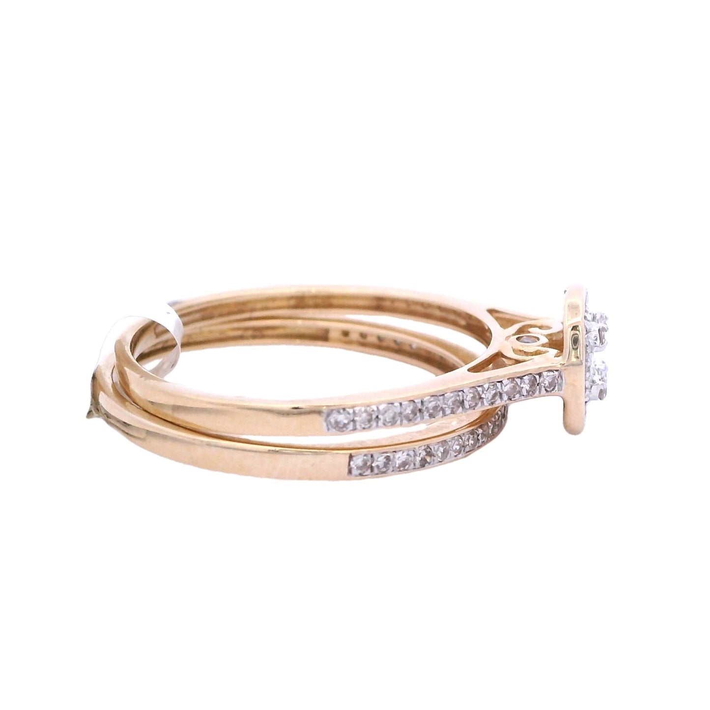 Side view of yellow gold bridal set. The engagement ring has a cushion center made up of small square diamonds. It has a halo around it made up of round diamonds, and is outlined in yellow gold. The band of the ring has round diamonds that go about halfway through each side of the band. It is on top of the wedding bands. The wedding band is under it. It is a yellow gold thin band with round white diamonds.