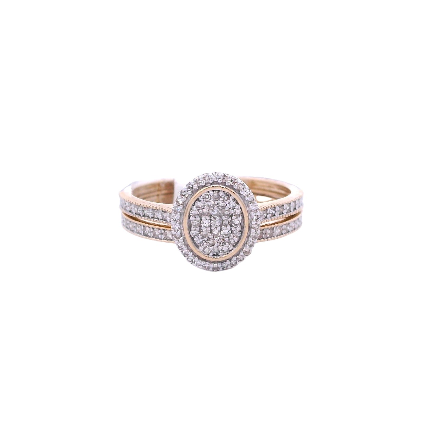 Front of yellow gold bridal set. The engagement ring center has an oval shape it is filled with round white diamonds. Outside the center there is an outline of thin yellow gold. Then there is a halo of round white diamonds surround the outline. The band has round diamonds on the sides. The wedding ban is laying below it. It has round white diamonds on the front and side of it.