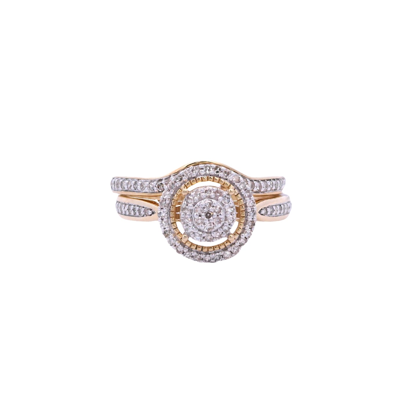 Front view of yellow gold bridal set. The center of the engagement ring is round, it has 2 tiers filled with small round diamonds. Then there is an empty space followed by a thin round gold outline. Outside of the outline there is a halo made up of round diamonds. The bands pinch at the center and expand to fill the sides with round diamonds. The wedding band has round diamonds in the front and sides. It follows the shape of the engagement ring.