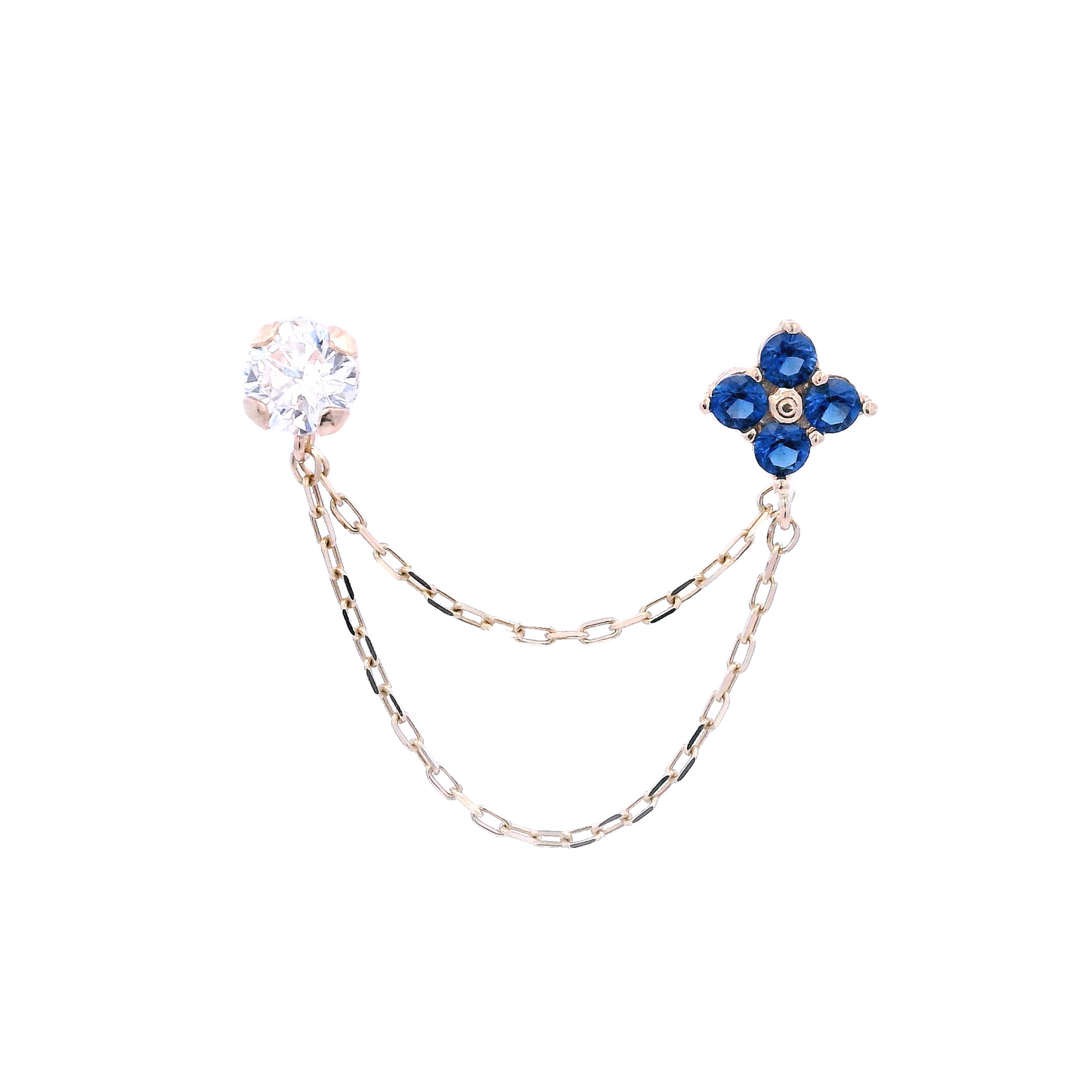 White round Zirconia stud with a flower stud that has 4 blue round zirconia. The studs are connected by two thin gold chains.