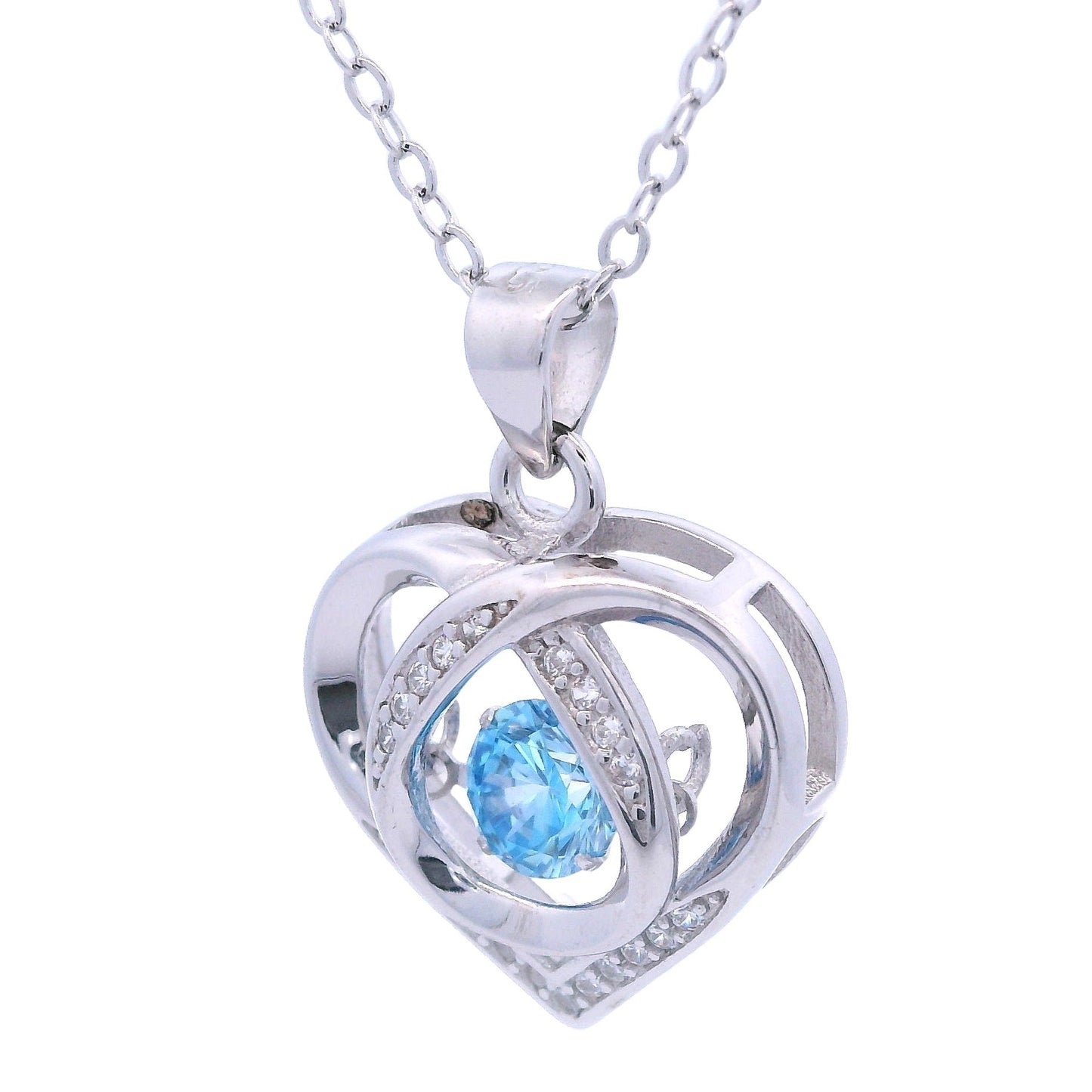 Side view of Sterling Silver heart pendant with white zirconia accents and a blue dangling zirconia in the center.