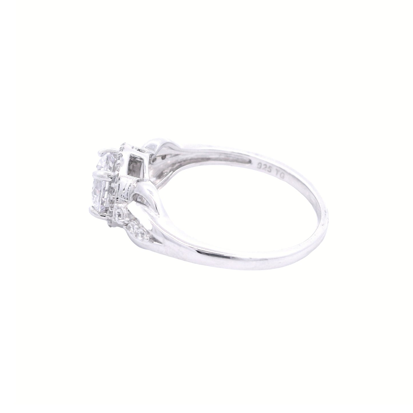 Side view of sterling silver ring with round-shaped zirconia in the center and a round halo. It has decorative swirls with round zirconia accents on each side.