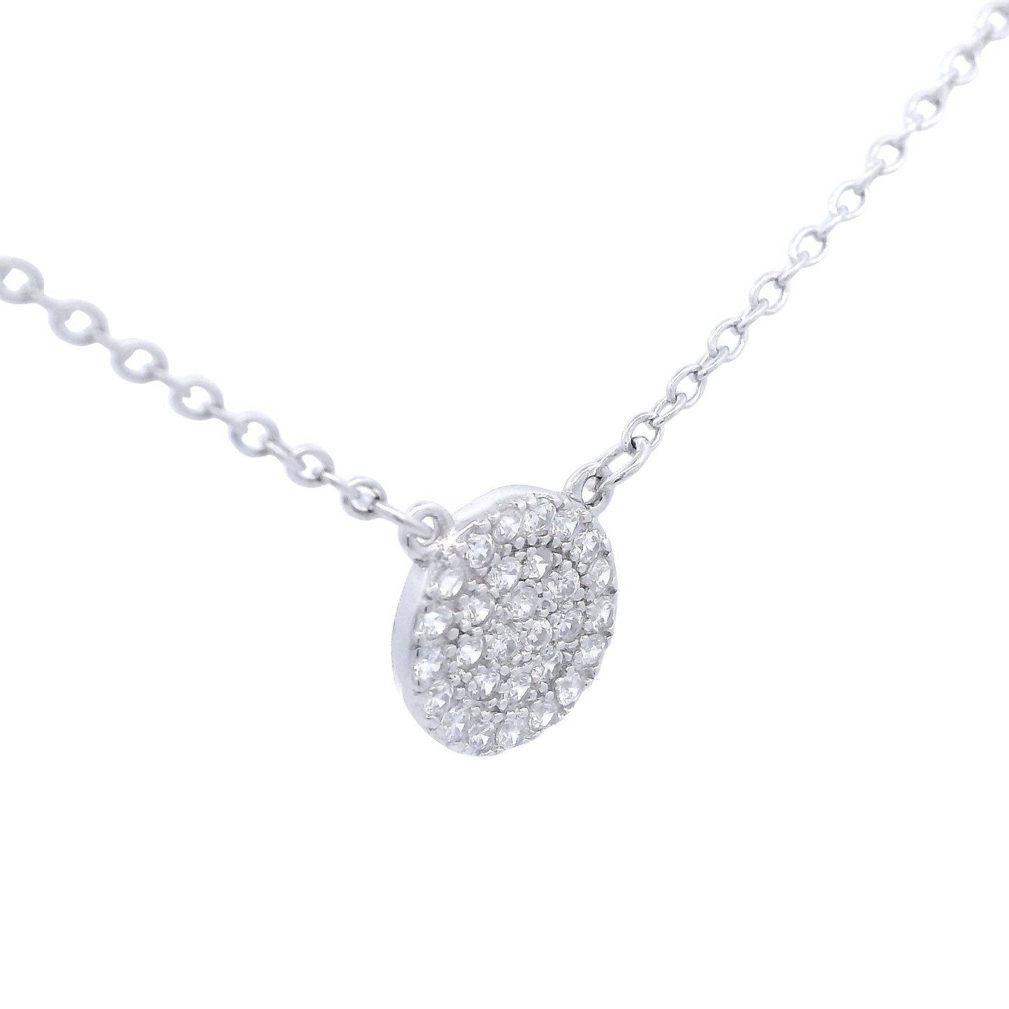 Silver necklace with round pendant with zirconia. Side view.