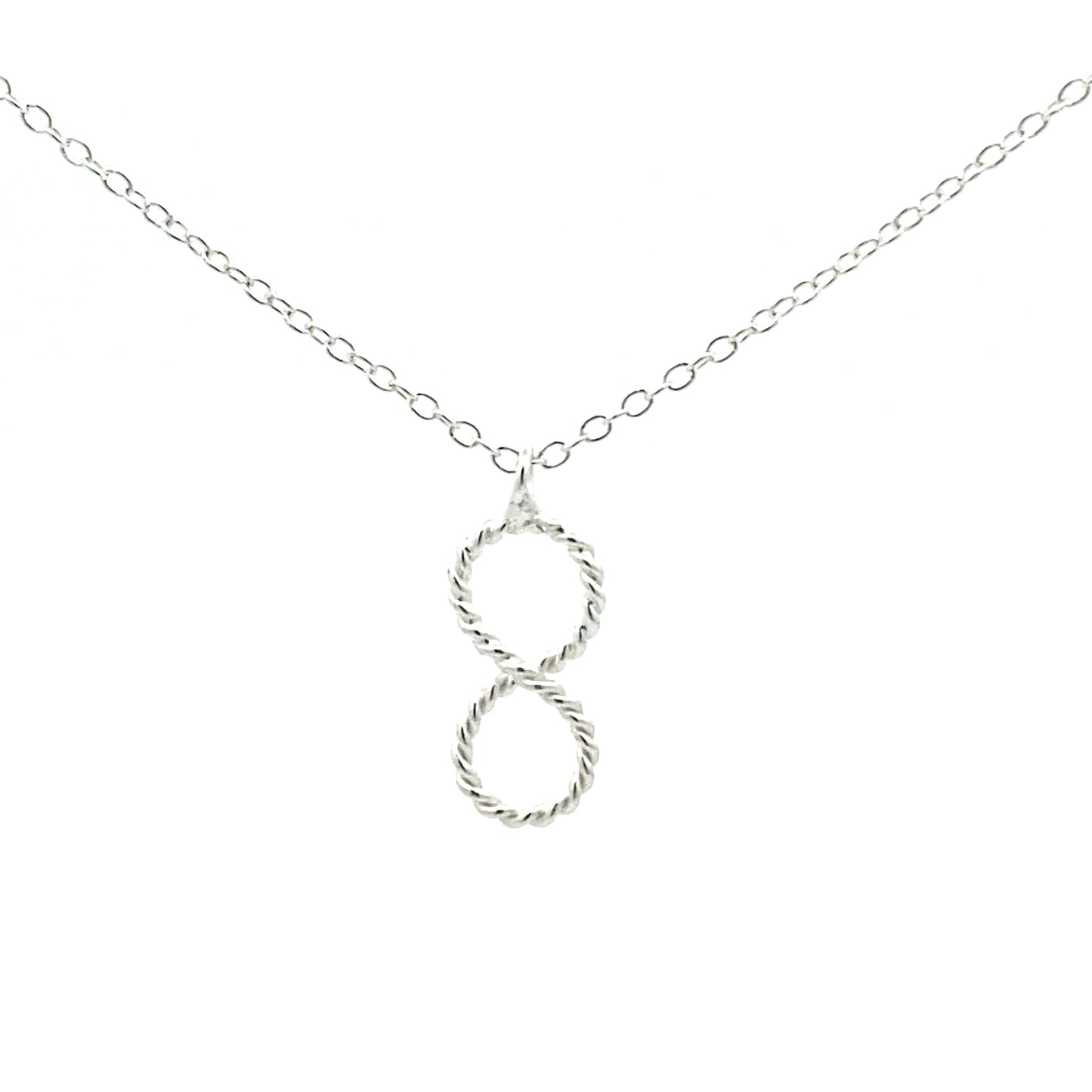 Silver vertical Infinity Pendant with rope texture and accompanying necklace. Close up.