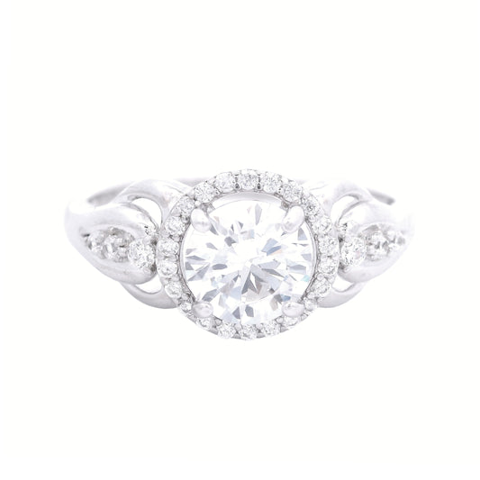 Front view of sterling silver ring with round-shaped zirconia in the center and a round halo.  It has decorative swirls with round zirconia accents on each side.