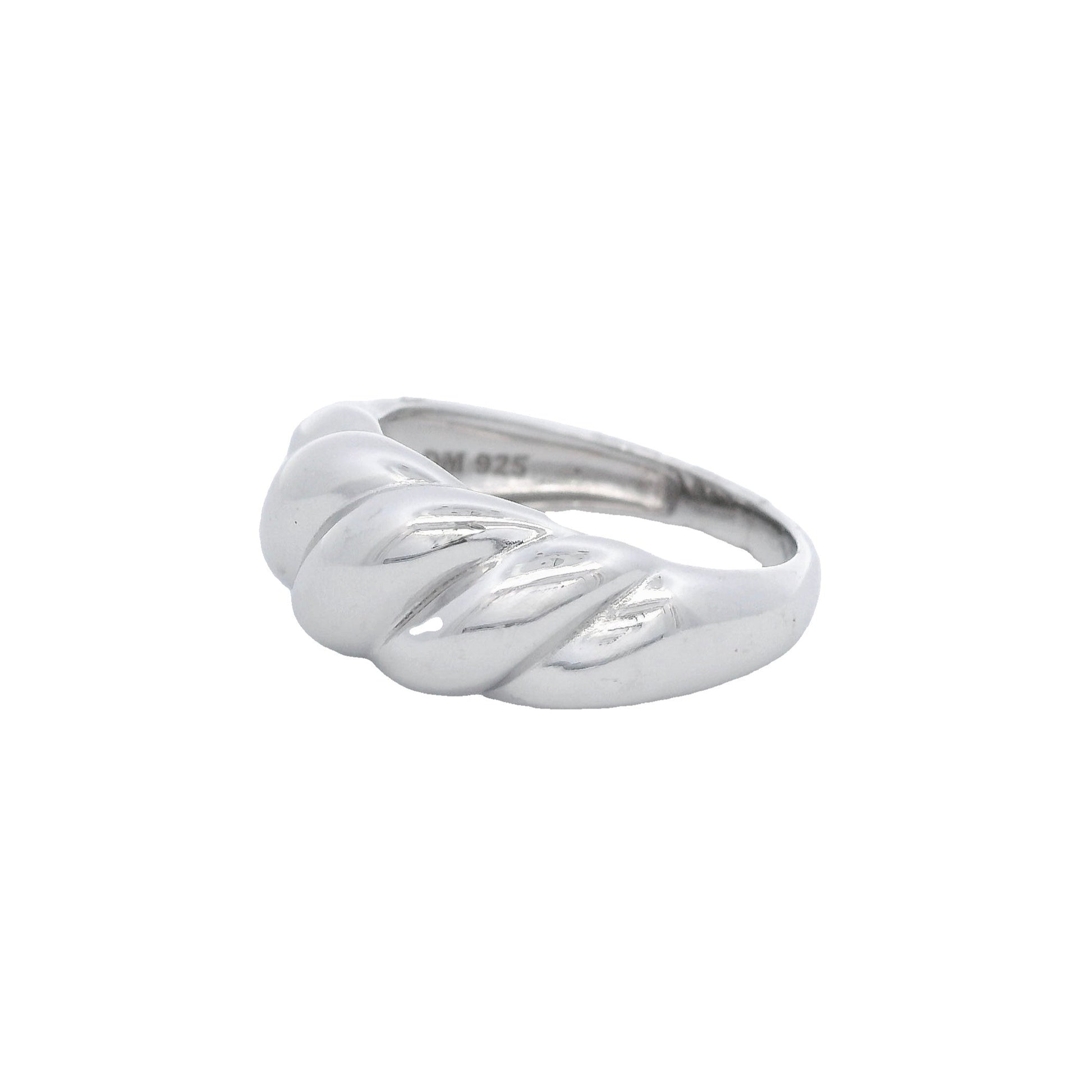Side view of silver ring that has graduated swirls with the largest in the center like a croissant.