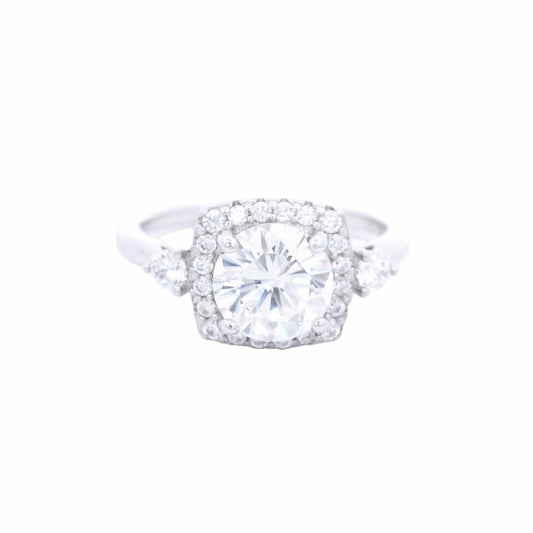 Front view of Sterling silver ring with round white zirconia and a rectangular halo with round white zirconia around it. There is a round white zirconia on each side of the band.