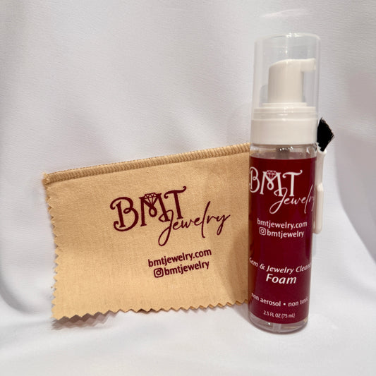 BMT Jewelry cleaning foam bottle and cloth on a white background