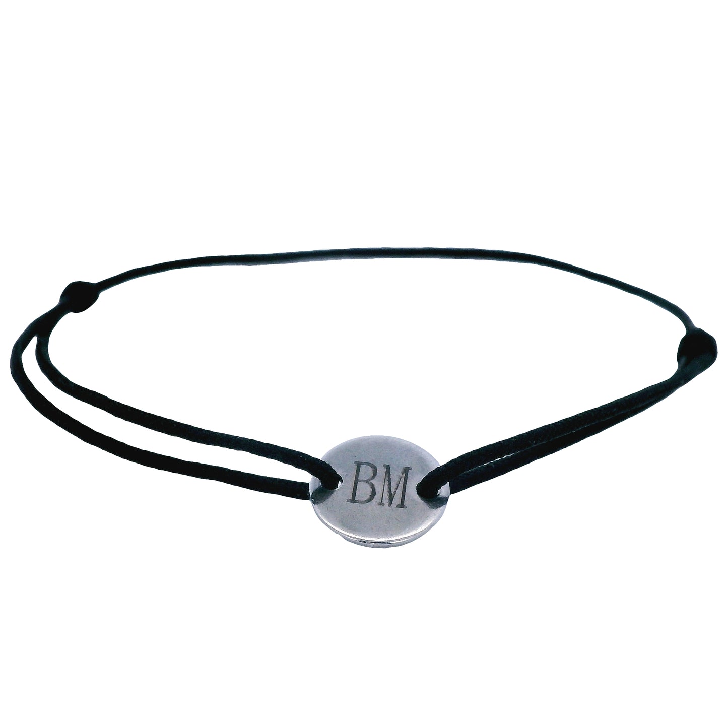 Black string bracelet with a round  stainless steel featuring the initials "B" and "M" in the middle on a white background