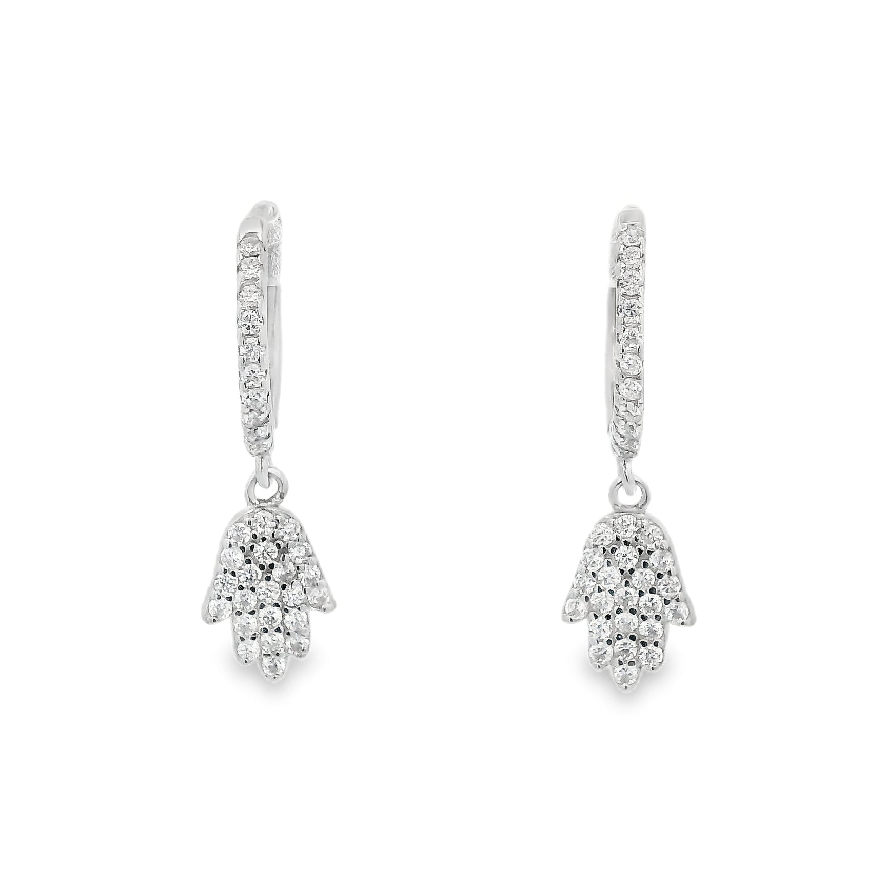 Front view of silver hoops with round clear zirconia and a hamsa hand that dangles below each huggie that also has round zirconia inside it.