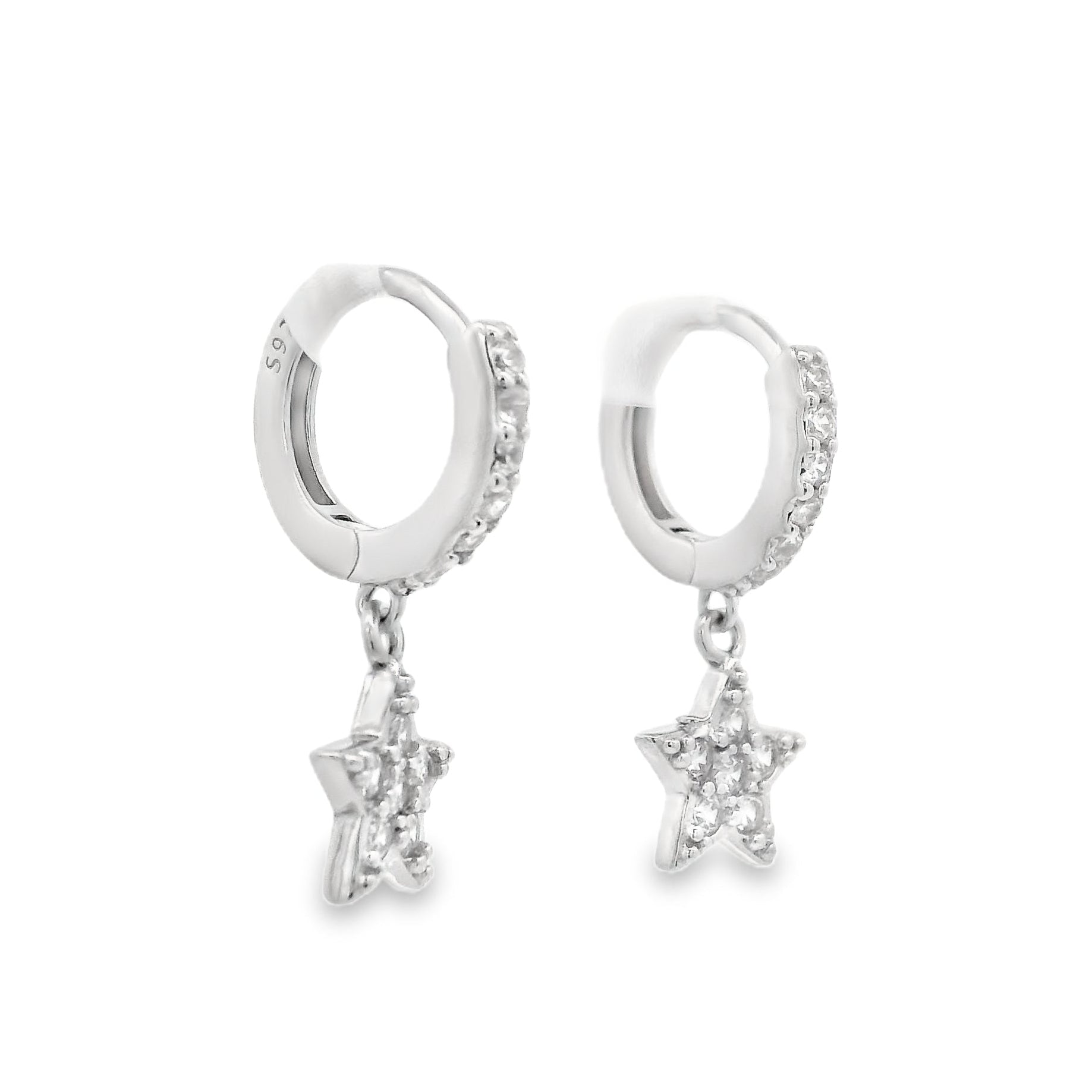 Angled side view of silver huggie hoops with a star that dangles below each hoops. The hoop and star are both filled with clear round zirconia.