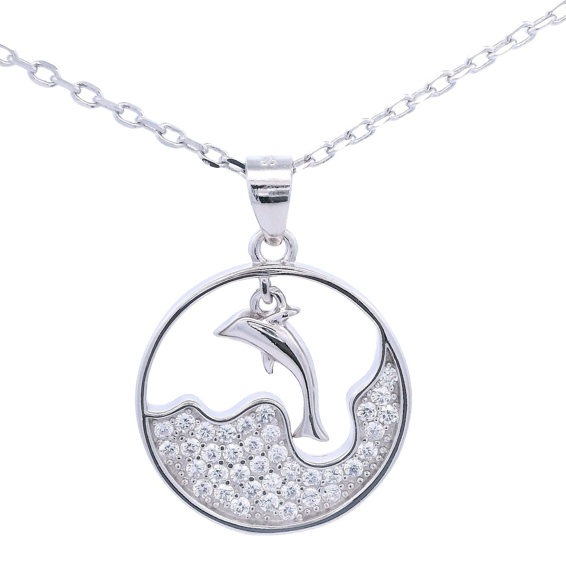 Silver necklace with round pendant that had a wave design with zirconia and a dangling dolphin in the center.